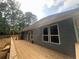 The backyard of the home features a large patio at 1119 Plantation Se Dr, Conyers, GA 30094