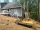Exterior of new home featuring new deck, stairs and landscaping at 1119 Plantation Se Dr, Conyers, GA 30094
