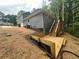 Exterior of new home featuring new deck, stairs and landscaping at 1119 Plantation Se Dr, Conyers, GA 30094