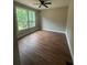 Bedroom with a ceiling fan and many windows at 1119 Plantation Se Dr, Conyers, GA 30094