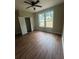 Bedroom featuring many windows and closet at 1119 Plantation Se Dr, Conyers, GA 30094