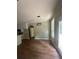 Bright dining room featuring a modern light fixture and outdoor access at 1119 Plantation Se Dr, Conyers, GA 30094