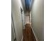 Hallway with flooring and ceiling access at 1119 Plantation Se Dr, Conyers, GA 30094