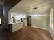 Open-concept kitchen featuring white cabinets, modern appliances, and a dining area at 1119 Plantation Se Dr, Conyers, GA 30094