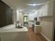Bright kitchen features white cabinets, stainless appliances, and a breakfast bar with seating at 1119 Plantation Se Dr, Conyers, GA 30094