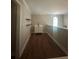 Loft area with a vanity, sink, and dark wood grain flooring providing an extra space at 1119 Plantation Se Dr, Conyers, GA 30094