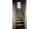 Ascending staircase with wood treads and white risers leads to the upper level at 1119 Plantation Se Dr, Conyers, GA 30094
