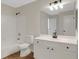 Bright bathroom featuring a white vanity, bath, shower, and modern fixtures at 164 Gleneagles Way, Fayetteville, GA 30215
