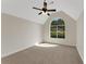 Bright, airy bedroom with neutral carpet, vaulted ceiling, and a large arched window at 164 Gleneagles Way, Fayetteville, GA 30215