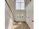 Inviting foyer with a staircase, large window, and a stylish double-door entrance at 164 Gleneagles Way, Fayetteville, GA 30215