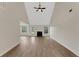 Bright, airy living room with high ceilings, fireplace, and stylish flooring at 164 Gleneagles Way, Fayetteville, GA 30215