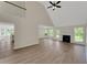 Bright, airy living room with high ceilings, fireplace, and stylish flooring at 164 Gleneagles Way, Fayetteville, GA 30215