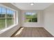Bright room featuring stylish floors and large windows with beautiful views at 164 Gleneagles Way, Fayetteville, GA 30215