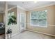 Bright dining area featuring carpeted floors, neutral walls, large windows, and elegant trim details at 245 Amal Sw Dr # 2018, Atlanta, GA 30315