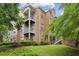 Brick apartment building featuring multiple balconies and well-maintained landscaping at 245 Amal Sw Dr # 2018, Atlanta, GA 30315
