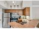 Well-lit kitchen featuring stainless steel appliances and a breakfast bar with a double sink at 245 Amal Sw Dr # 2018, Atlanta, GA 30315