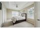 Tranquil main bedroom featuring large windows, plush carpeting, and a ceiling fan at 245 Amal Sw Dr # 2018, Atlanta, GA 30315