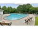 Large swimming pool surrounded by lounge chairs and lush greenery for a serene atmosphere at 245 Amal Sw Dr # 2018, Atlanta, GA 30315