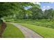 Scenic community walking path surrounded by lush greenery, perfect for an active lifestyle at 245 Amal Sw Dr # 2018, Atlanta, GA 30315