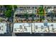 Aerial view of the building rooftops with surrounding parking and landscaping at 360 Chambers St # 405, Woodstock, GA 30188
