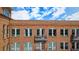 Close-up of the brick building facade and a balcony accessible by a glass door at 360 Chambers St # 405, Woodstock, GA 30188