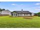 Exterior shot of backyard featuring a large manicured yard at 4490 Epworth Court Ct, Powder Springs, GA 30127