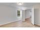 Airy bedroom with hardwood floors and an open door to another room, providing flow and flexibility at 4490 Epworth Court Ct, Powder Springs, GA 30127