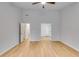 A bedroom with tall ceilings, hardwood floors and neutral walls at 4490 Epworth Court Ct, Powder Springs, GA 30127