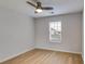 Bright bedroom with neutral walls and hardwood floors, providing a peaceful and minimalist space at 4490 Epworth Court Ct, Powder Springs, GA 30127