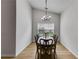 Dining room with high ceilings, neutral walls, and a modern light fixture over the dining table at 4490 Epworth Court Ct, Powder Springs, GA 30127