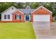 Charming single-story brick home with well-kept lawn and a two-car garage at 4490 Epworth Court Ct, Powder Springs, GA 30127