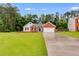 Charming single-story brick home with a well-manicured lawn and attached two-car garage at 4490 Epworth Court Ct, Powder Springs, GA 30127