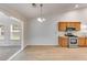 Bright kitchen features wood cabinets, stainless steel appliances, and sleek countertops, offering a modern cooking space at 4490 Epworth Court Ct, Powder Springs, GA 30127