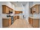 Well-lit kitchen featuring wood cabinets, stainless steel appliances, and a functional layout at 4490 Epworth Court Ct, Powder Springs, GA 30127