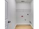 The laundry room includes hardwood floors, modern appliances, and room for shelving at 4490 Epworth Court Ct, Powder Springs, GA 30127