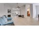 Bright living room with fireplace, high ceilings, and open layout to the kitchen at 4490 Epworth Court Ct, Powder Springs, GA 30127