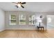 Sun-drenched living room boasts natural light and hardwood floors, creating a warm and inviting atmosphere at 4490 Epworth Court Ct, Powder Springs, GA 30127