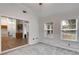 Stylish living room featuring hardwood floors and an open layout, seamlessly connecting to the kitchen at 4490 Epworth Court Ct, Powder Springs, GA 30127