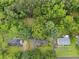 Overhead view of a charming home with a large, verdant yard and mature trees offering ample shade at 48 Saddle Field Nw Cir, Cartersville, GA 30121