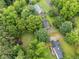 Bird's-eye view of a cozy home surrounded by a lush landscape, providing privacy and a serene setting at 48 Saddle Field Nw Cir, Cartersville, GA 30121
