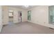 Bedroom features soft carpet, two windows, with an open walkway to the ensuite bathroom and walk-in closet at 48 Saddle Field Nw Cir, Cartersville, GA 30121
