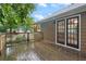 Private deck with wood railings and glass paneled doors leading to the main house at 48 Saddle Field Nw Cir, Cartersville, GA 30121