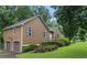 Home with a garage, well-kept lawn, and charming landscaping offering an inviting curb appeal at 48 Saddle Field Nw Cir, Cartersville, GA 30121