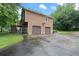 Exterior elevation features a two-car garage, private driveway, and backyard access at 48 Saddle Field Nw Cir, Cartersville, GA 30121