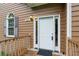 Front door view of home, with siding, storm door and welcome mat at 48 Saddle Field Nw Cir, Cartersville, GA 30121