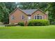 Charming home with well-maintained lawn and landscaping creating inviting curb appeal at 48 Saddle Field Nw Cir, Cartersville, GA 30121