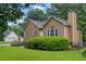 Well-kept home featuring a manicured lawn, shrubbery and walkway, offering great curb appeal at 48 Saddle Field Nw Cir, Cartersville, GA 30121