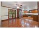 Spacious kitchen featuring stainless steel appliances, wooden cabinets, and hardwood floors, ideal for cooking at 48 Saddle Field Nw Cir, Cartersville, GA 30121