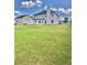 Large backyard provides plenty of space for outdoor activities and relaxation at 520 Harmony Way, Locust Grove, GA 30248