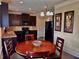 Cozy breakfast nook featuring a circular table and modern dark cabinets at 520 Harmony Way, Locust Grove, GA 30248